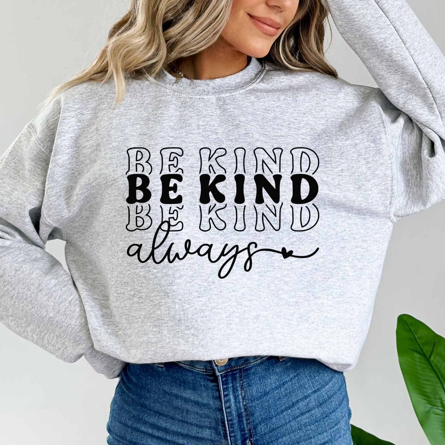 A soft, grey sweatshirt with the phrase Be Kind Always written. 